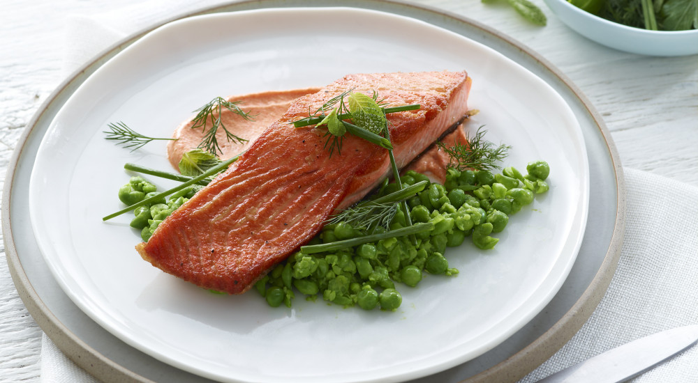 Roasted (pan fried) ocean trout with crushed peas and capsicum mayonnaise